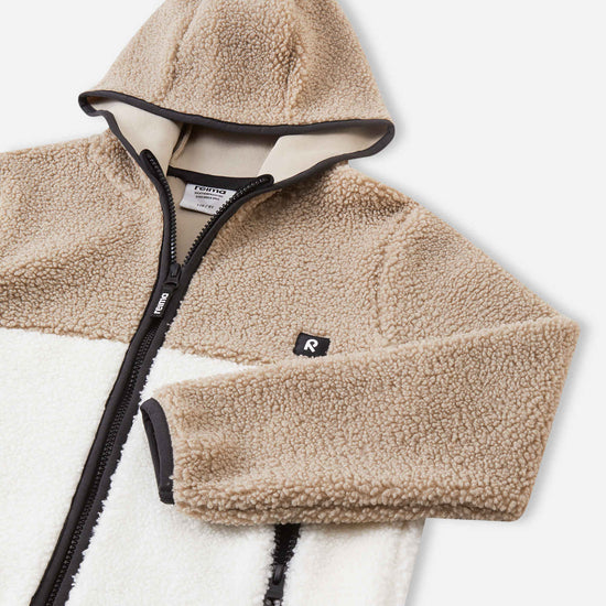 Giacca in pile Teddy Reima Muhkea per bambini, color Earthy Beige – Dettagli prodotto